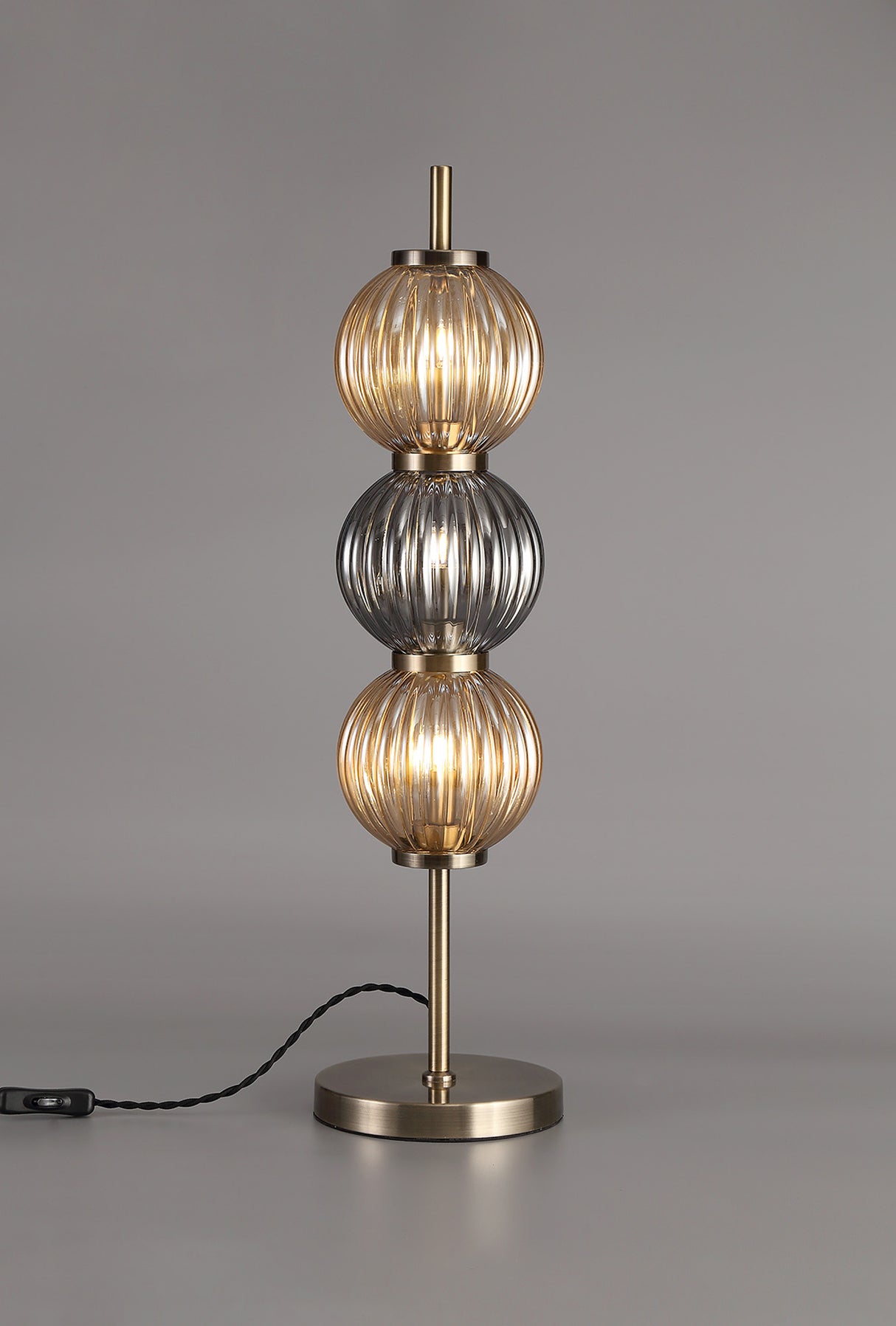 FRA6447 Franz 67cm Table Lamp 3 Light in a Antique Brass/Smoked/Amber Finish