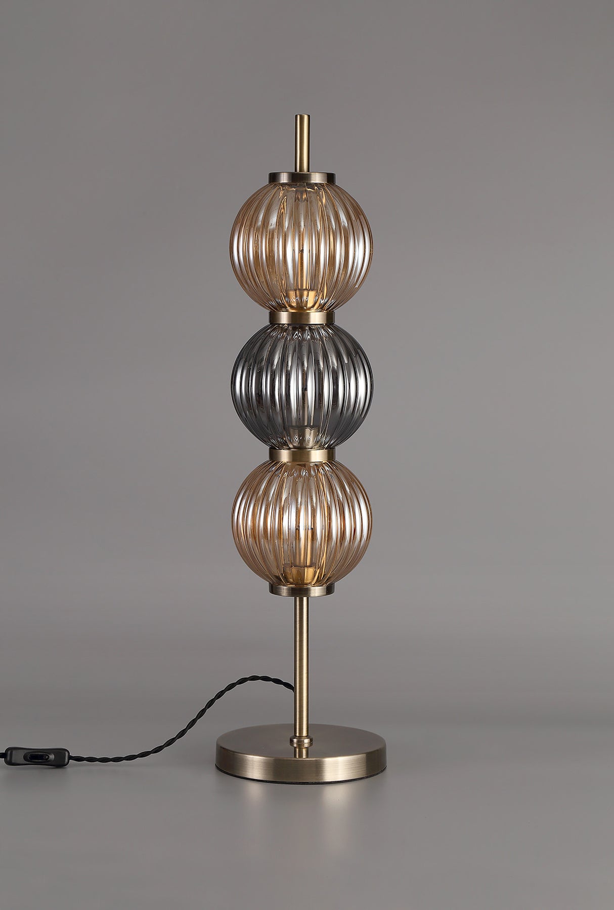 FRA6447 Franz 67cm Table Lamp 3 Light in a Antique Brass/Smoked/Amber Finish