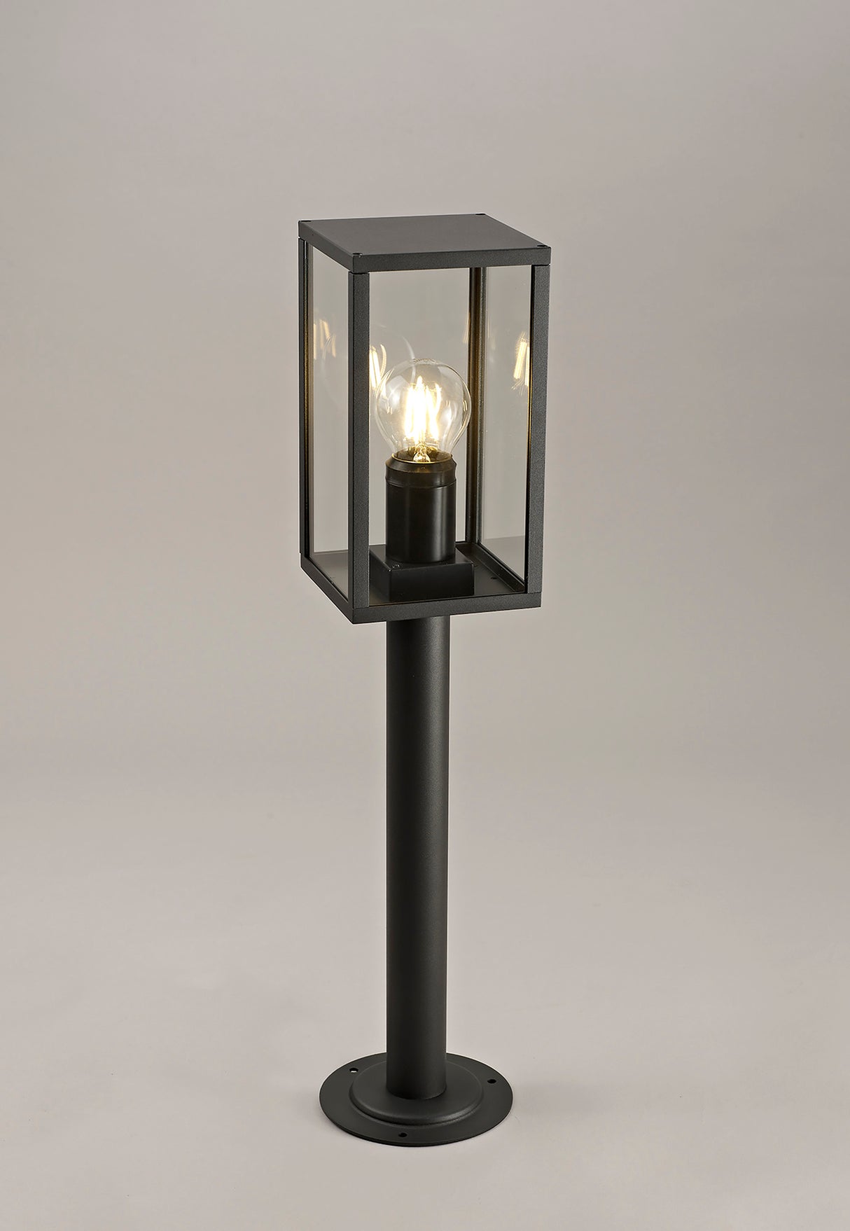 MER9117 Merga 58cm Short Post 1 Light IP54 Indoor/Outdoor Use in a Graphite Black/Clear Finish